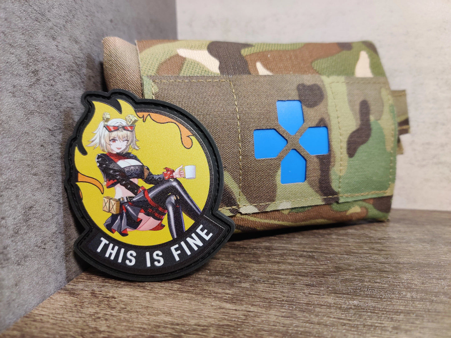 Custom made UV-Printed PVC patches featuring Burnice White, from Zenless Zone Zero in fusion with the iconic meme of an anthropomorphic dog trying to assure himself that everything is fine, despite sitting in a room that is engulfed in flames.
