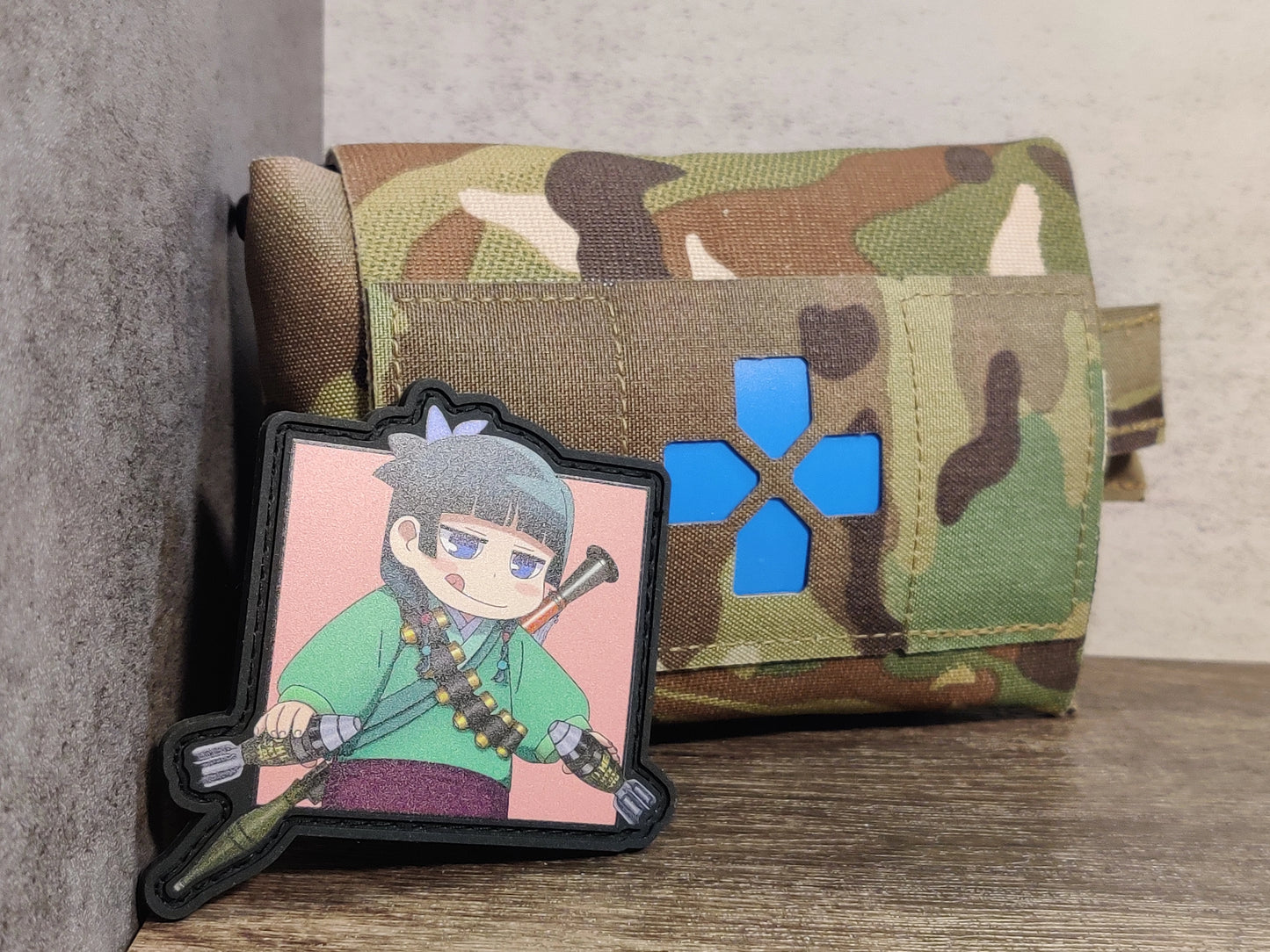 Custom made UV-Printed PVC patches featuring Maomao from Apothecary Diaries chilling with her collections of weaponries!