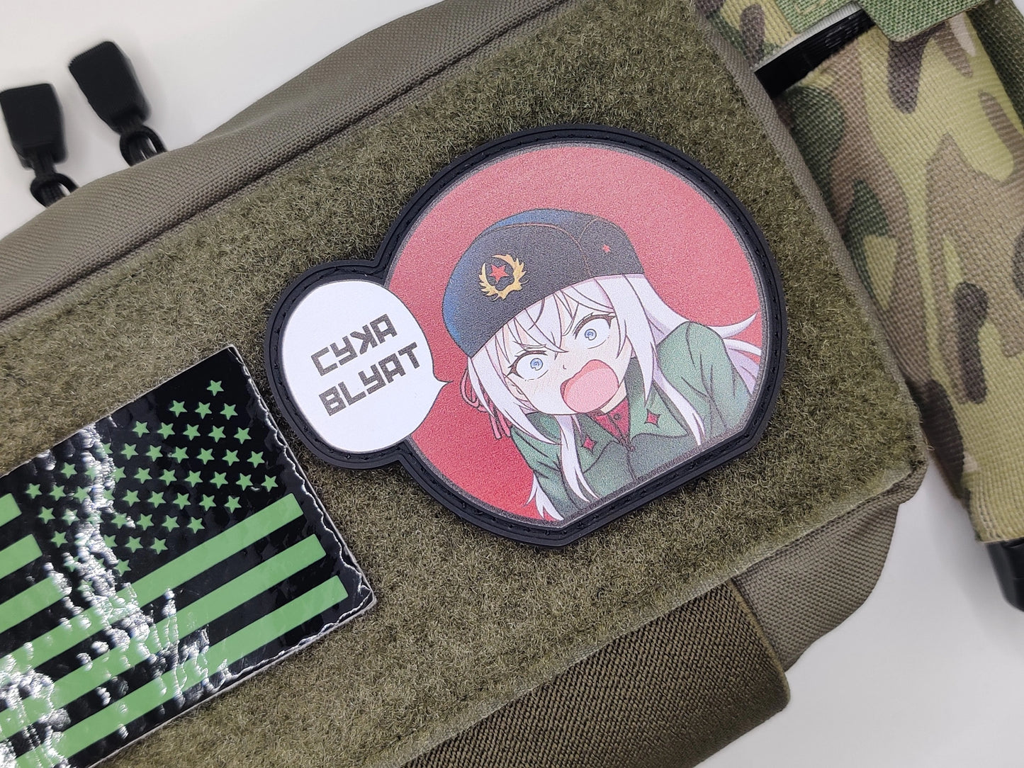 Patch with anime character and text on a green bag