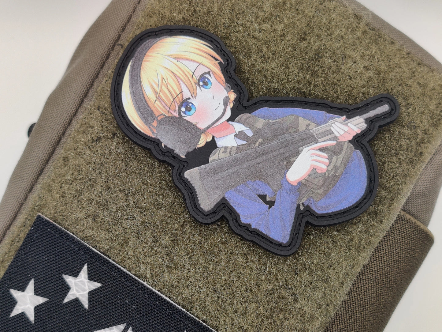 Darjeeling from Girls und Panzer anime wearing a body armor and holding a SA80 rifle with a green texture background