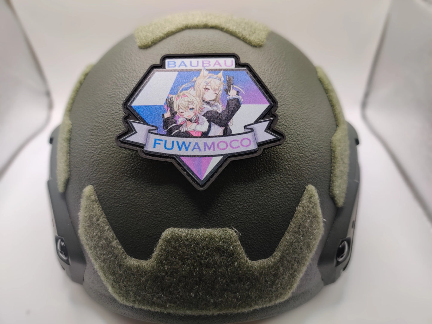Helmet with a decorative patch featuring an anime character and text on a white background