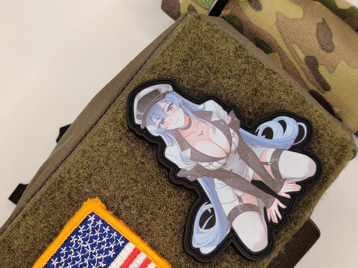 Esdeath patch on a tactical pouch with American flag patch