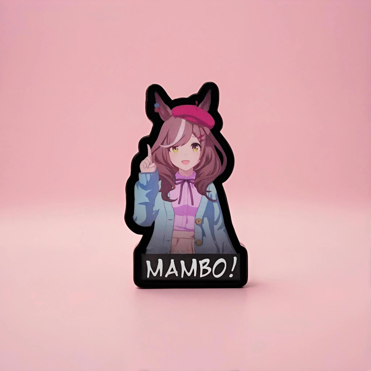 Anime-style character patch with 'MAMBO!' text at the bottom on a pink background