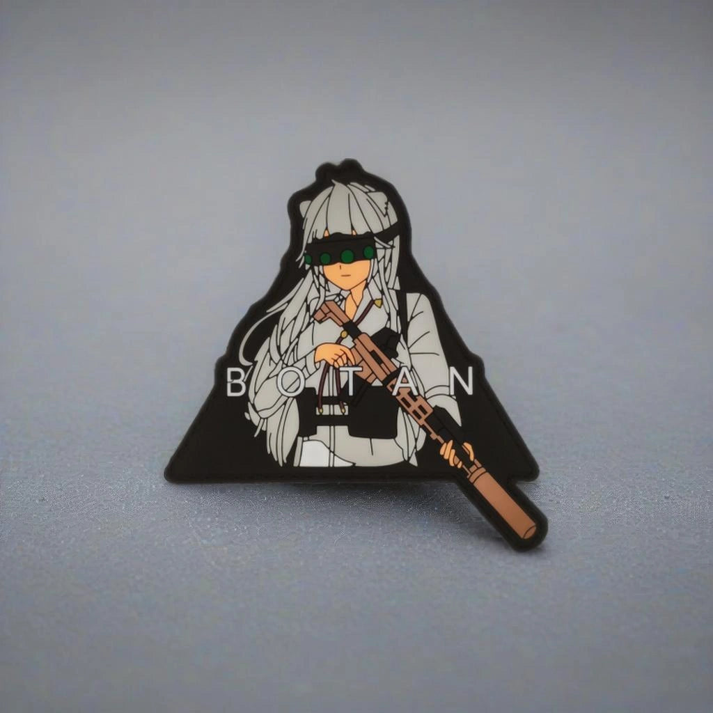 Pin with an anime-style character holding a gun on a gray background