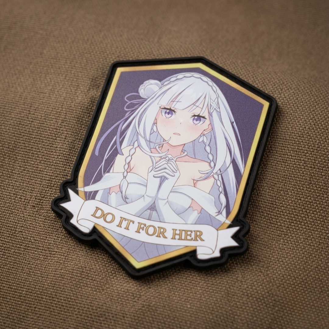 Emelia DO IT FOR HER velcro patch mounted on tactical gear, showing gold trim and hook backing detail