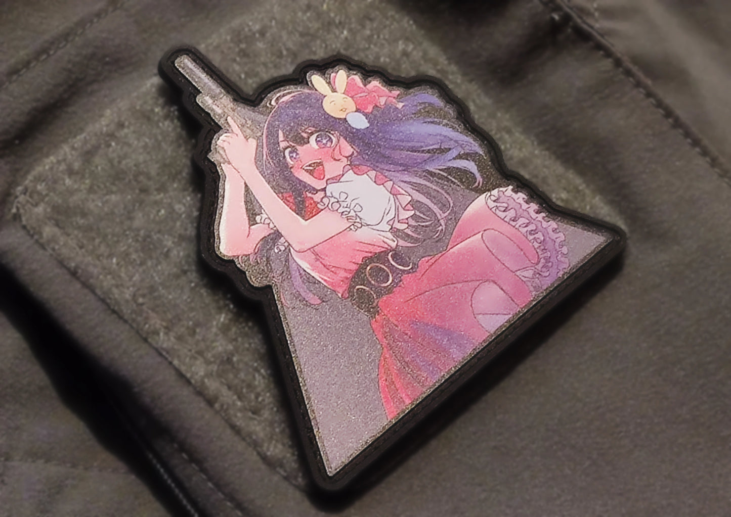 Anime-style character patch on a textured surface