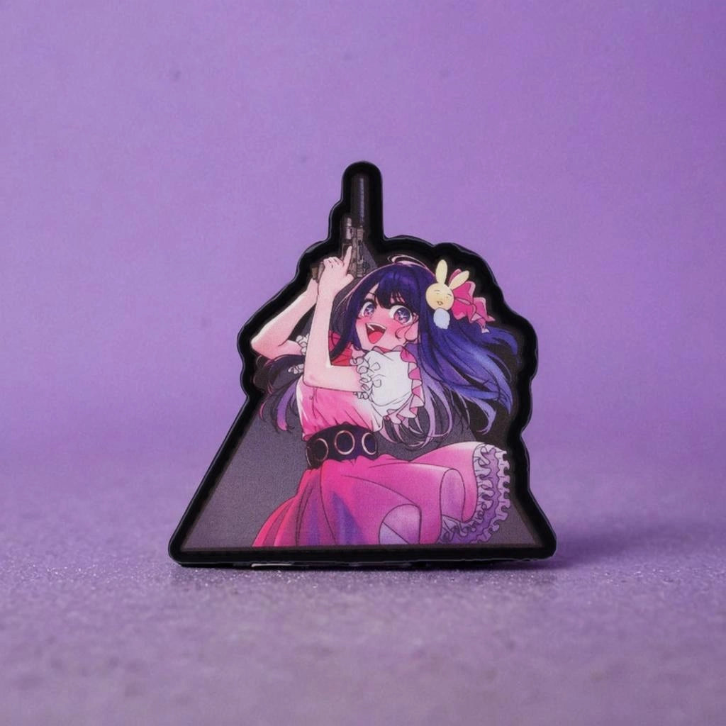 Patch with anime-style character holding a gun on a purple background