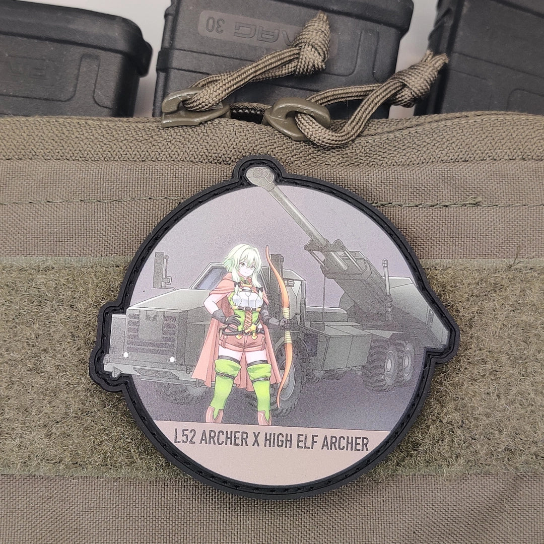 Lifestyle shot, patch mounted on a bag beside mag pouches and a paracord zipper pull — use to signal "this belongs in your actual loadout," not just a shelf display.