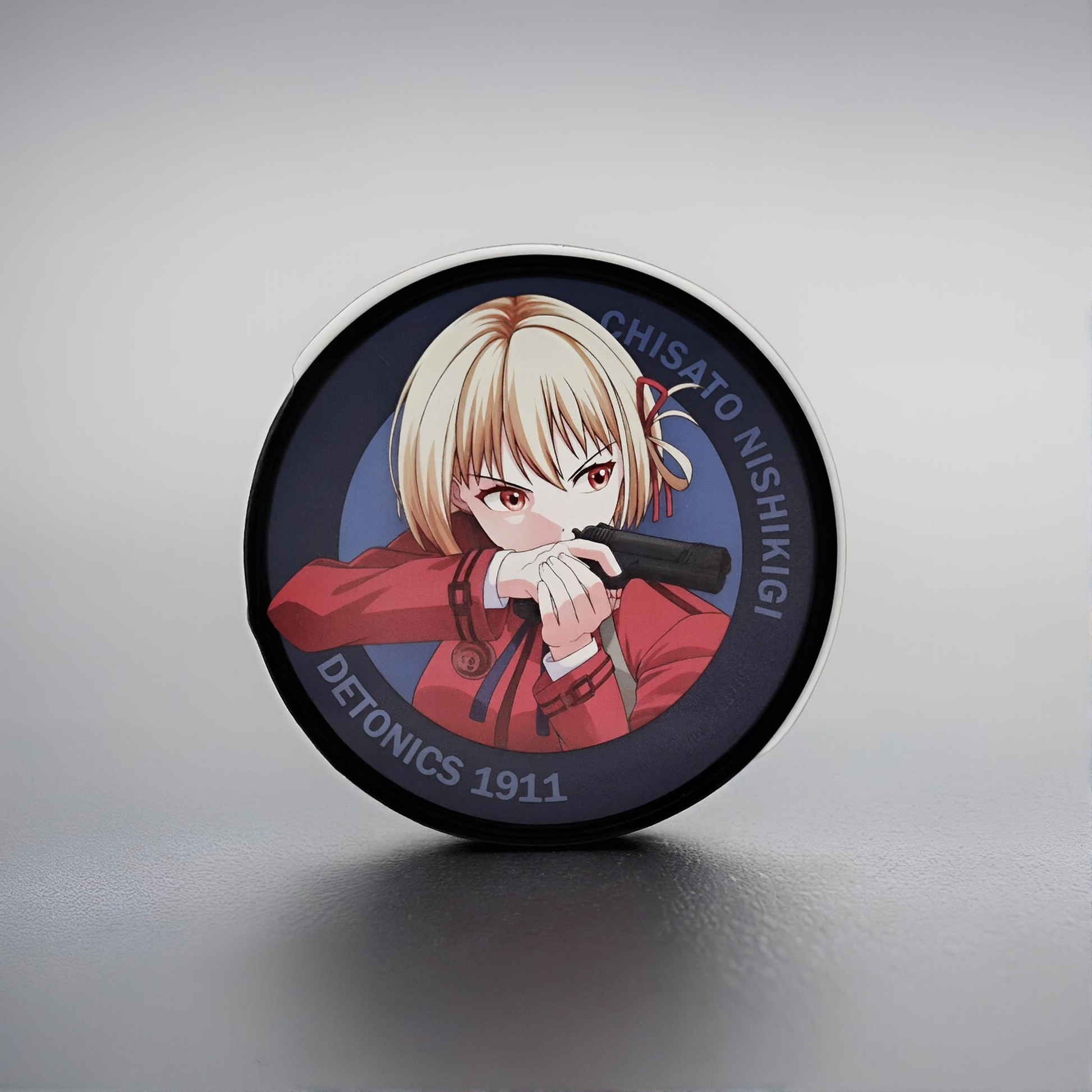 Circular product with illustration of Chisato Nishikigi from Lycoris Recoil on a gray background