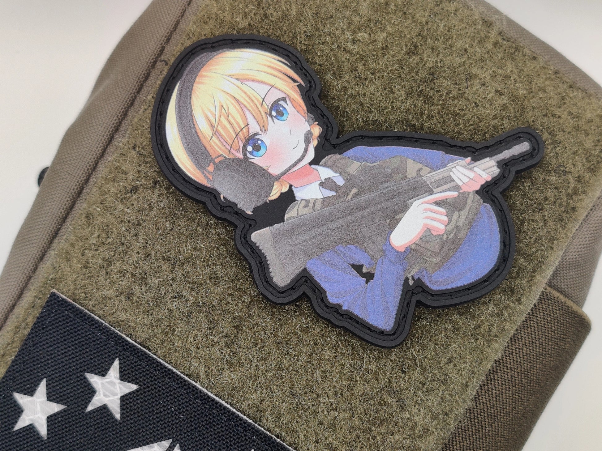 Darjeeling from Girls und Panzer anime wearing a body armor and holding a SA80 rifle with a green texture background