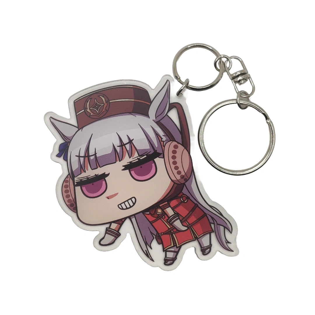 Keychain with Gold Ship from Uma Musume design on a white background