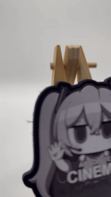 chibi version of Hatsune Miku with 'Absolute Cinema' text on a white background