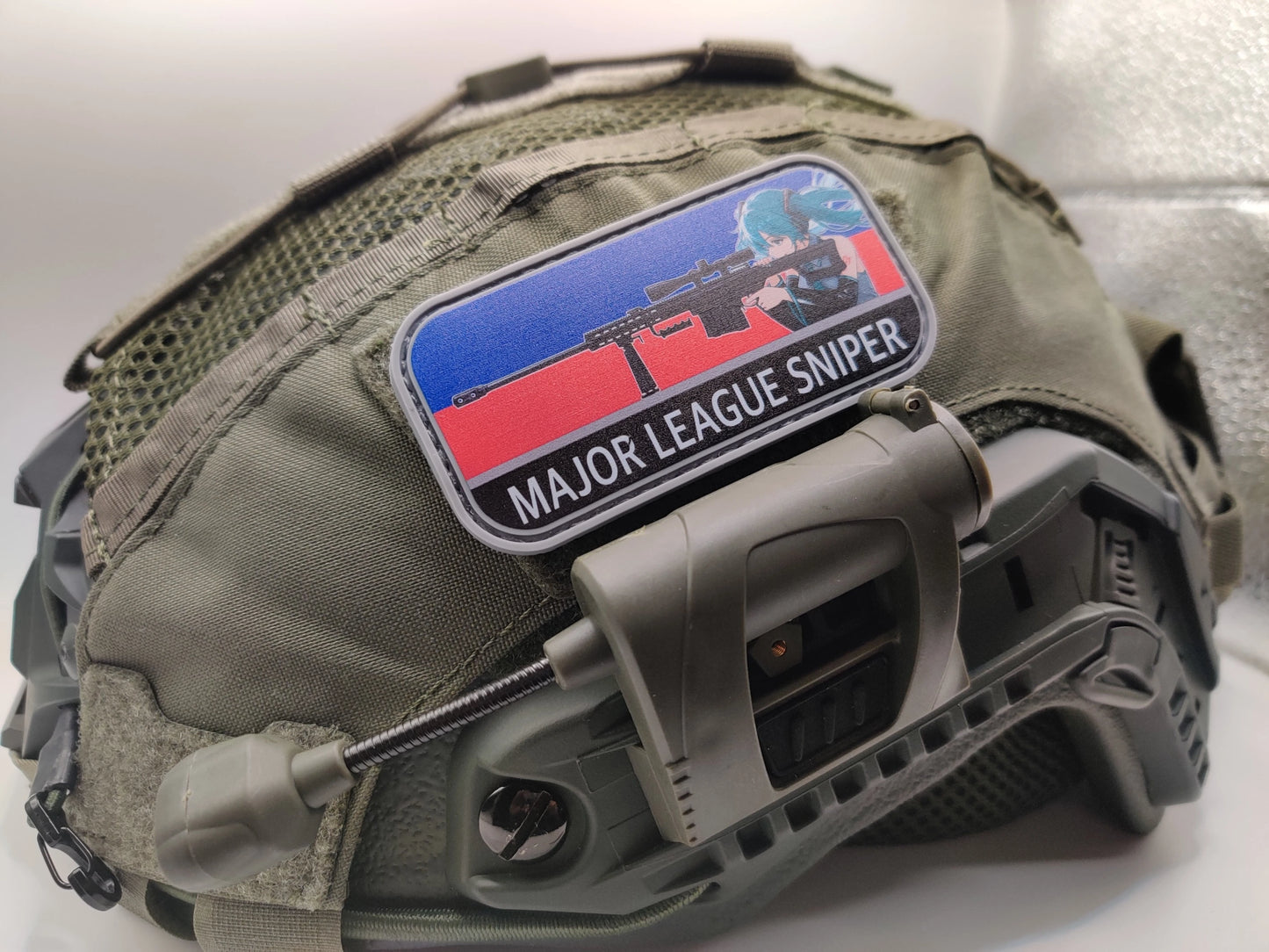 Tactical helmet with a 'Major League Sniper' and Hatsune Miku patch on a white background