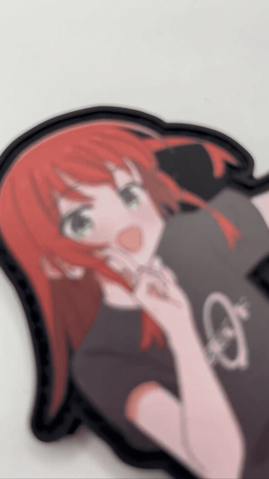 Anime character sticker with red hair and a black shirt on a white background
