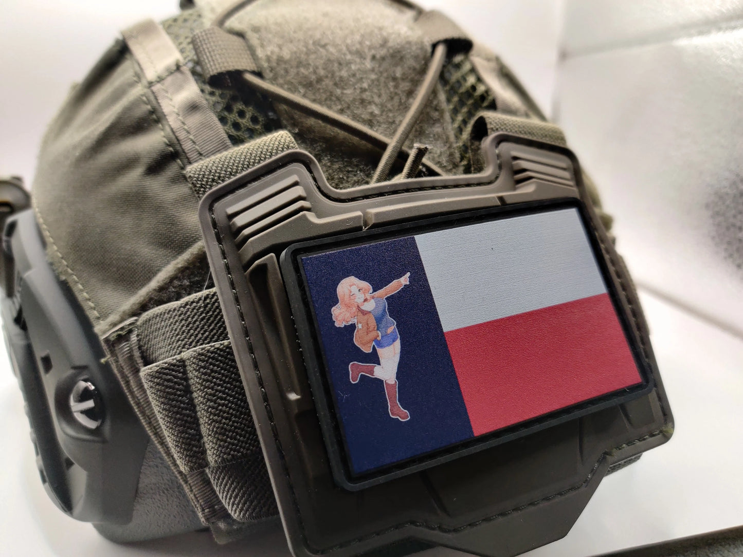 Tactical helmet with a texas flag patch featuring Kay from Girls und Panzer on a white background