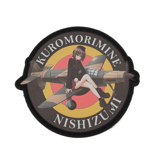 Circular patch with Maho_Nishizumi sitting on a german airplane and text 'Kuromorimine Nishizumi' on a white background