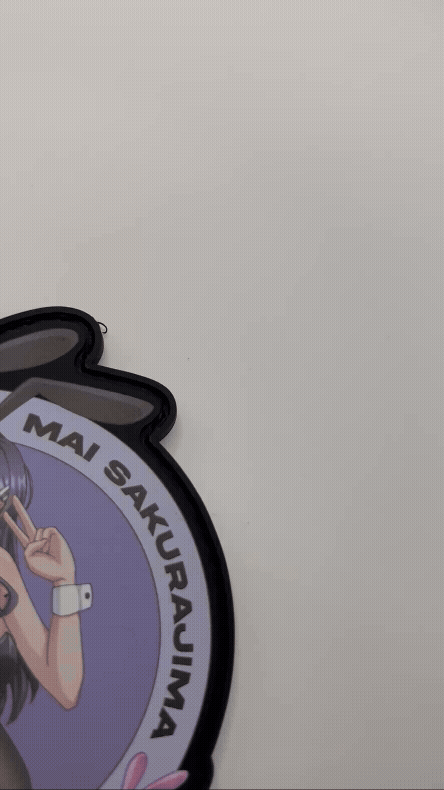 Circular badge with Mai Sakurajimaand text on a white background