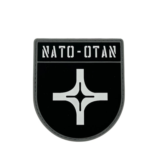 NATO-OTAN logo on a black background