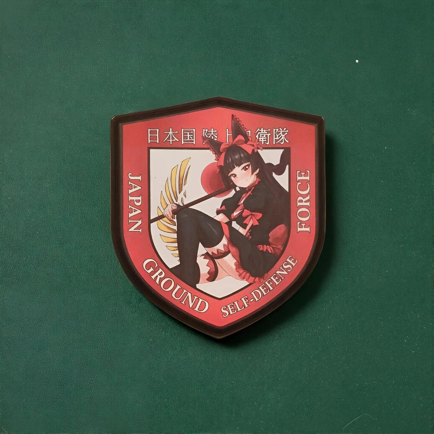 Emblem of Japan Ground Self-Defense Force with an anime-style of rory mercury from the anime Gate on a green background