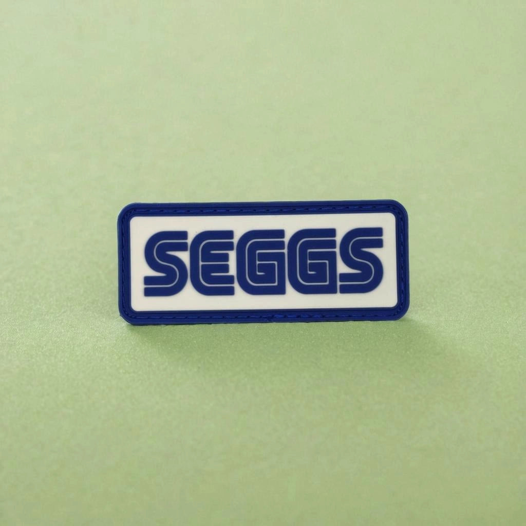 SEGGS logo patch on a green background