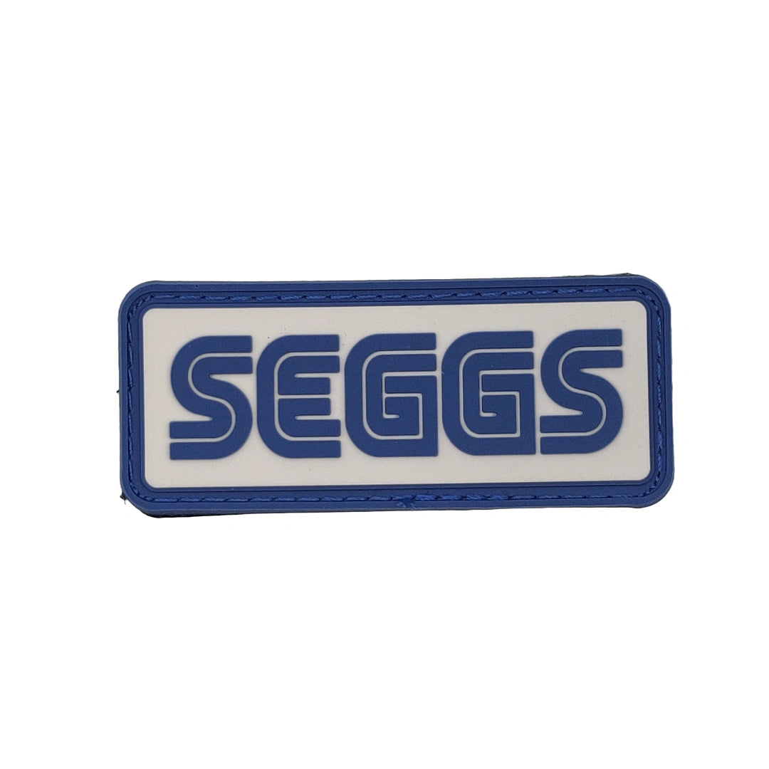 Patch with 'SEGGS' text on a white background