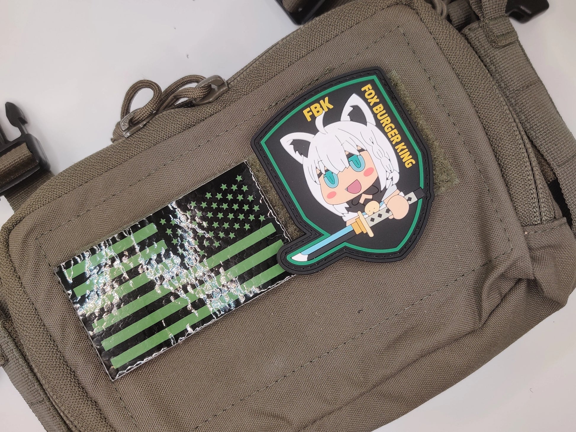 Patch on a bag with cartoon character and text 'Fox Burger King' on a white background