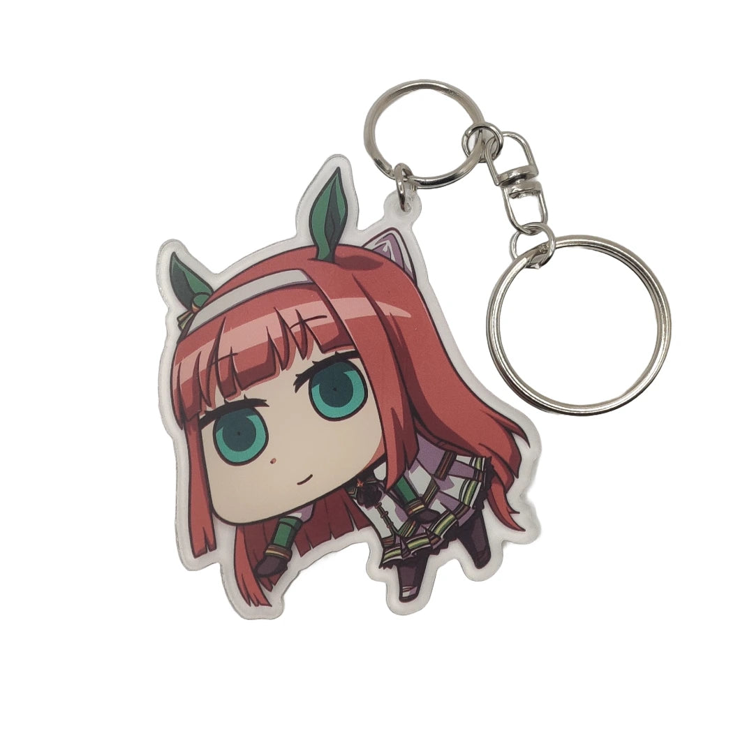 Anime character of silence suzuka from uma musume keychain with red hair and green eyes on a white background