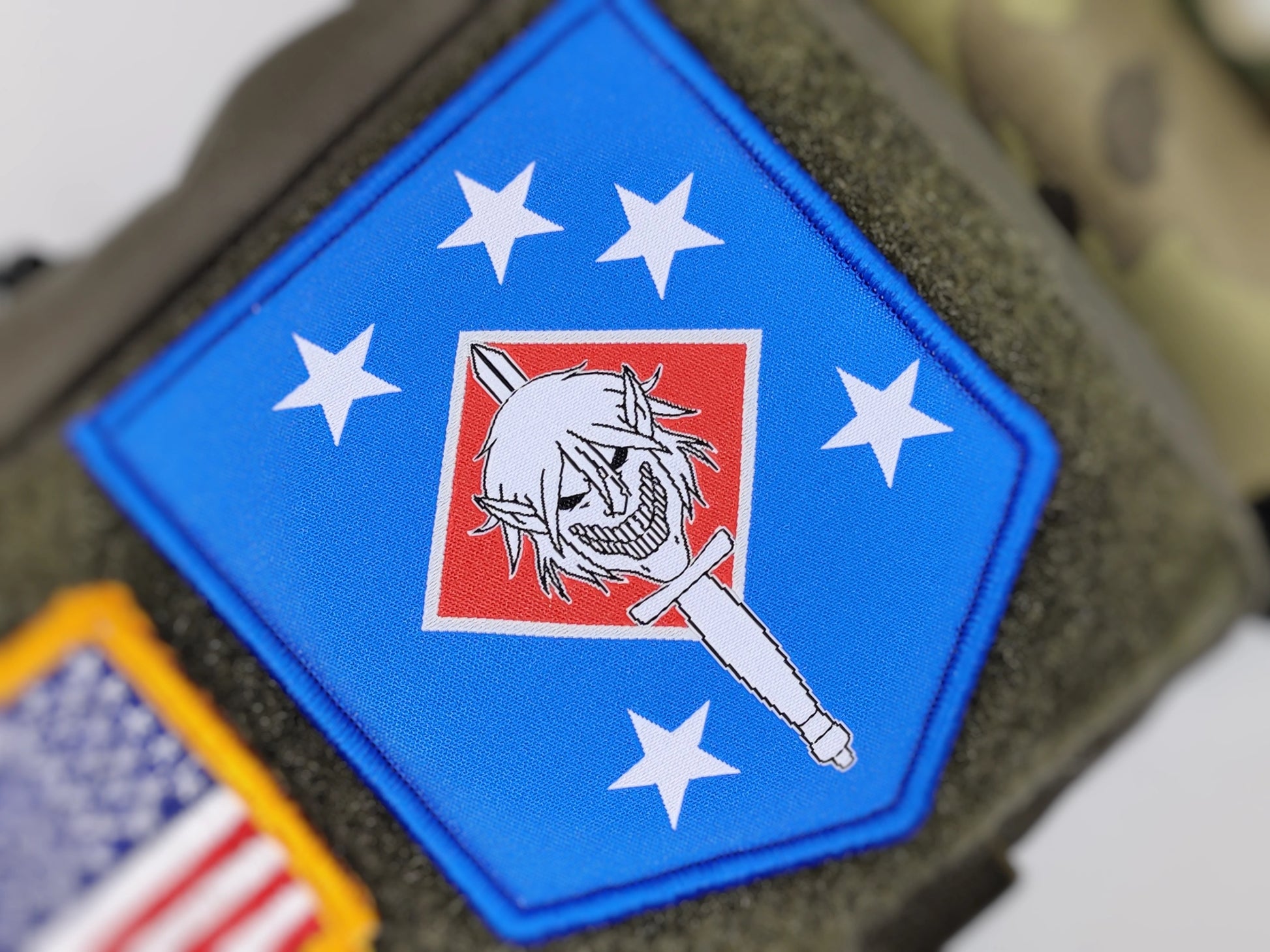 Jaeger Attack Titan skull on USMC Raider parody morale patch close up