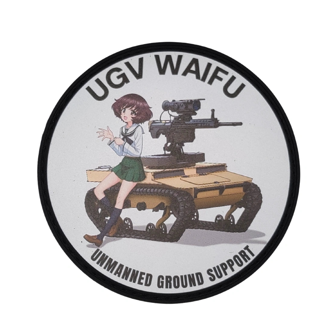 A circular sticker or patch featuring an anime-style illustration of a girl sitting on a tank with the text 'UGV WAIFU' at the top and 'UNMANNED GROUND SUPPORT' at the bottom, shown on a plain white background.