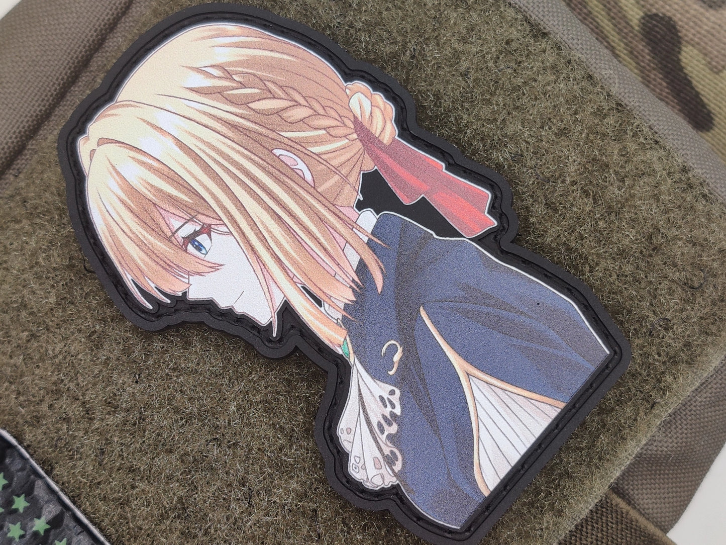 Violet Evergarden patch on a textured surface