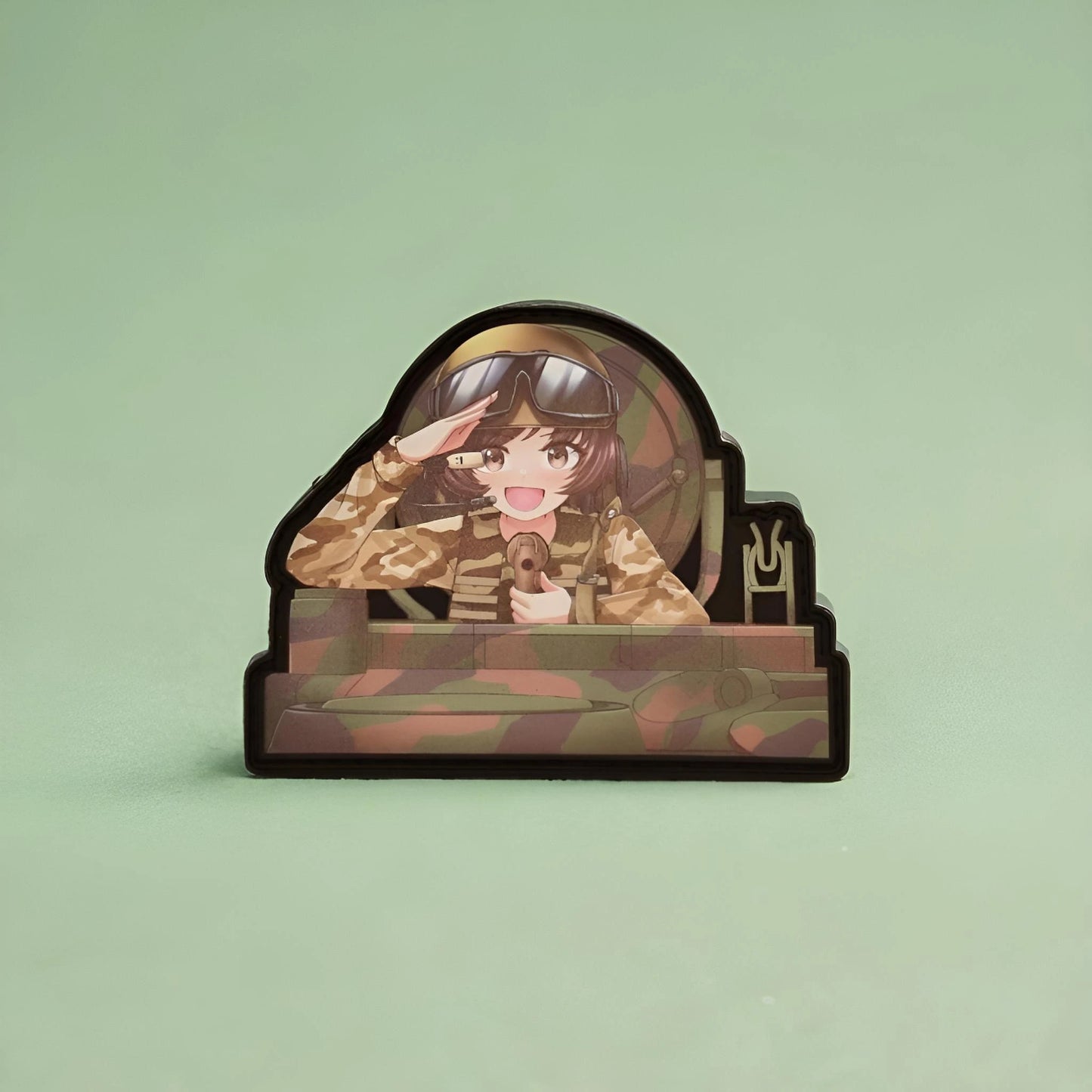Anime character of Yukari from girls and panzer patch with a camouflage design on a light green background