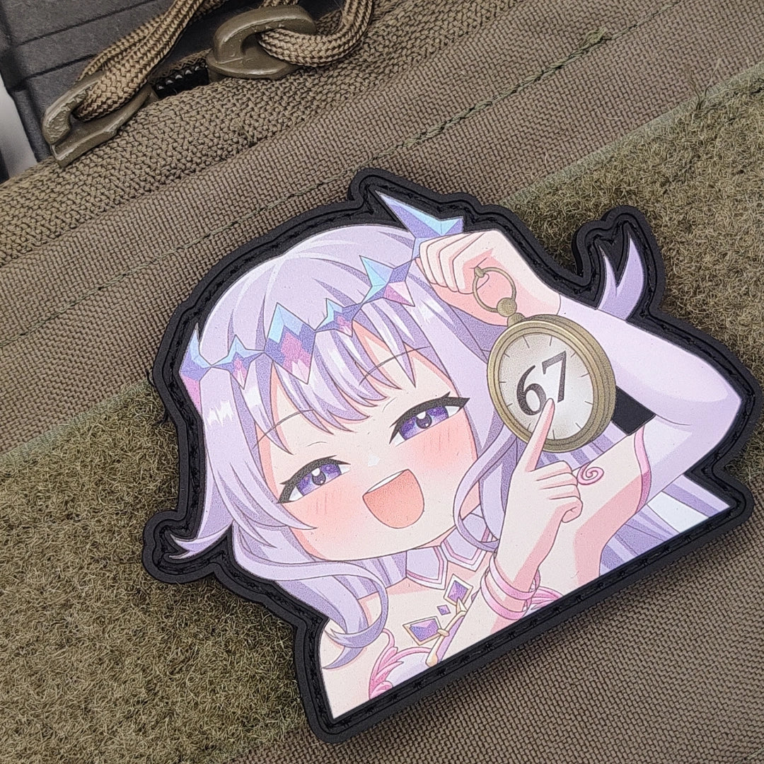 Koseki Bijou "67" meme patch attached to tan tactical backpack with hook and loop velcro, showing Jewel of Emotions design on gear