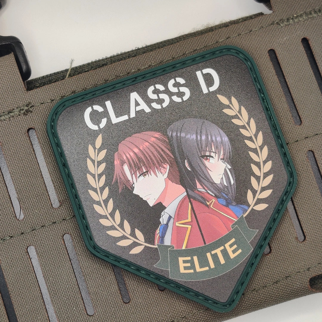 Angled close-up of the navy border Classroom of the Elite Class D patch showing Ayanokoji and Horikita artwork