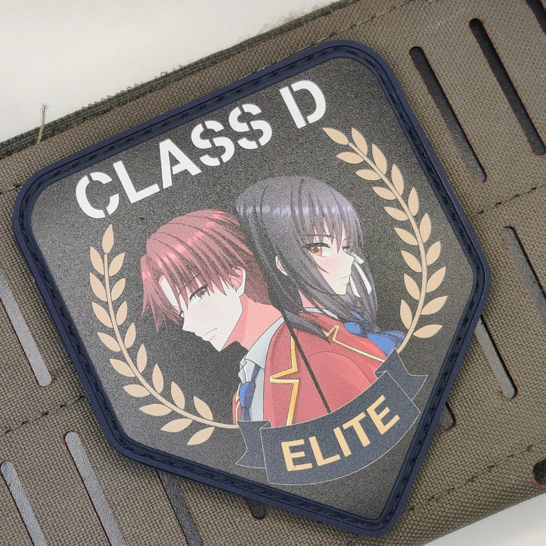 Close-up of navy border Class D Elite Ayanokoji Horikita patch velcroed onto tan tactical webbing