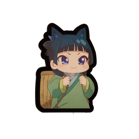 A custom made UV printed PVC patch featuring a chibi-style anime character with cat ears and a green outfit, smiling and holding a container.