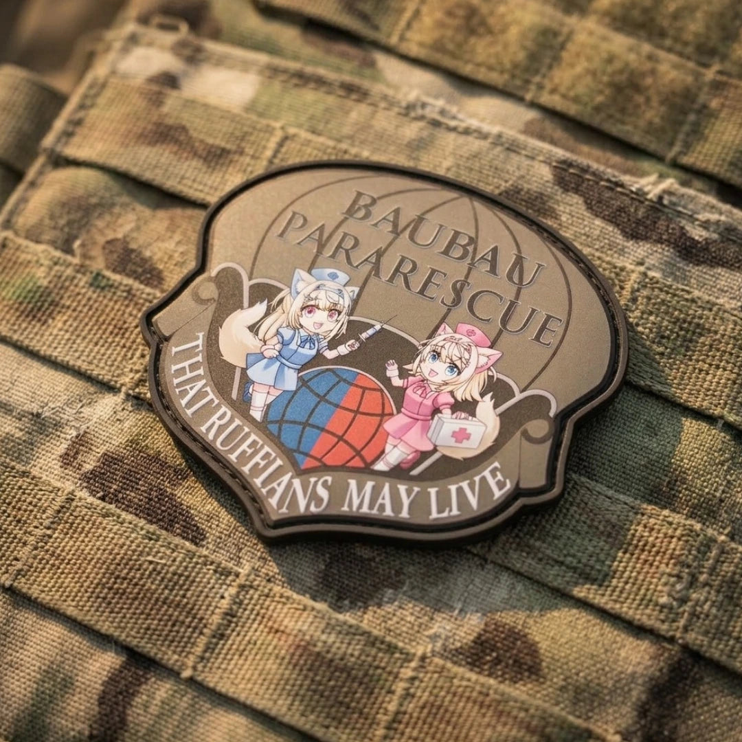 FUWAMOCO Pararescue patch featuring Fuwawa and Mococo twin guard dogs with globe design and "That Ruffians May Live" text affixed to camouflage tactical MOLLE fabric with hook-and-loop velcro