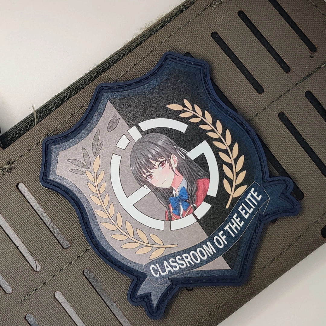 Navy border Suzune Horikita Classroom of the Elite patch velcroed to tan MOLLE tactical webbing