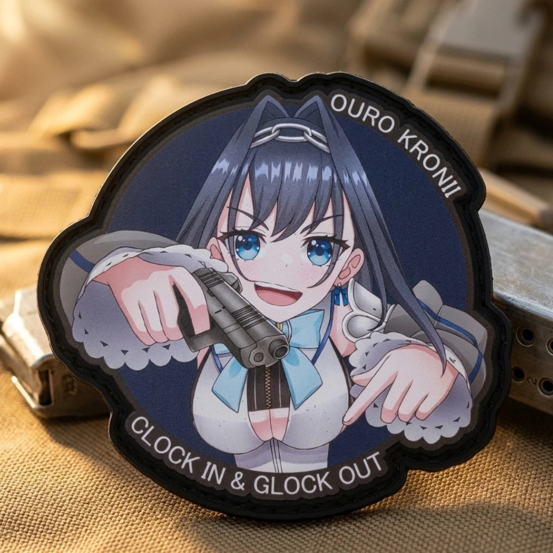 Ouro Kronii "Clock In & Glock Out" tactical patch 3.4 inches featuring Warden of Time in blue outfit with dual pistols on tan fabric with natural lighting