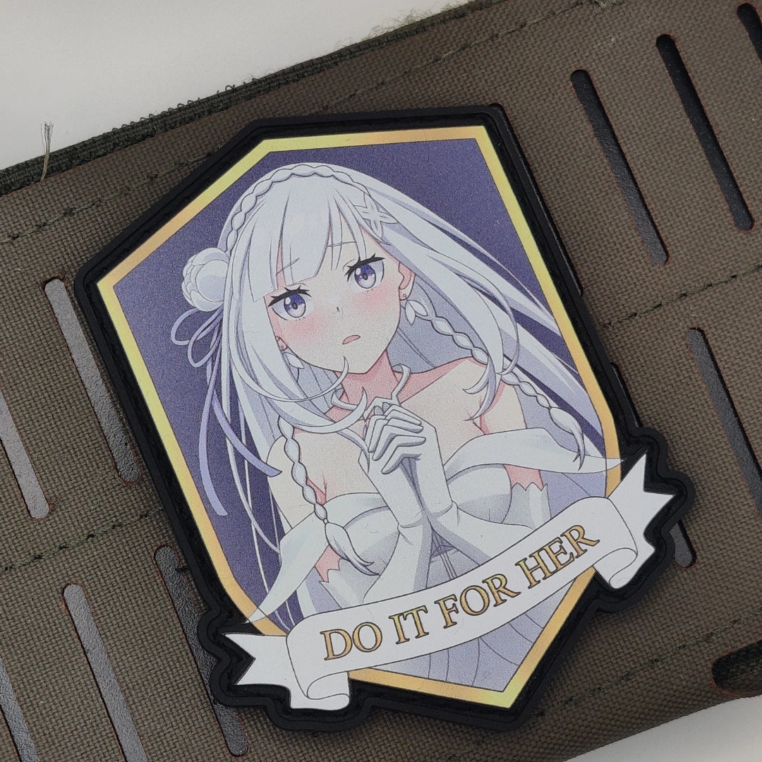 Emelia DO IT FOR HER velcro patch mounted on tactical gear, showing gold trim and hook backing detail