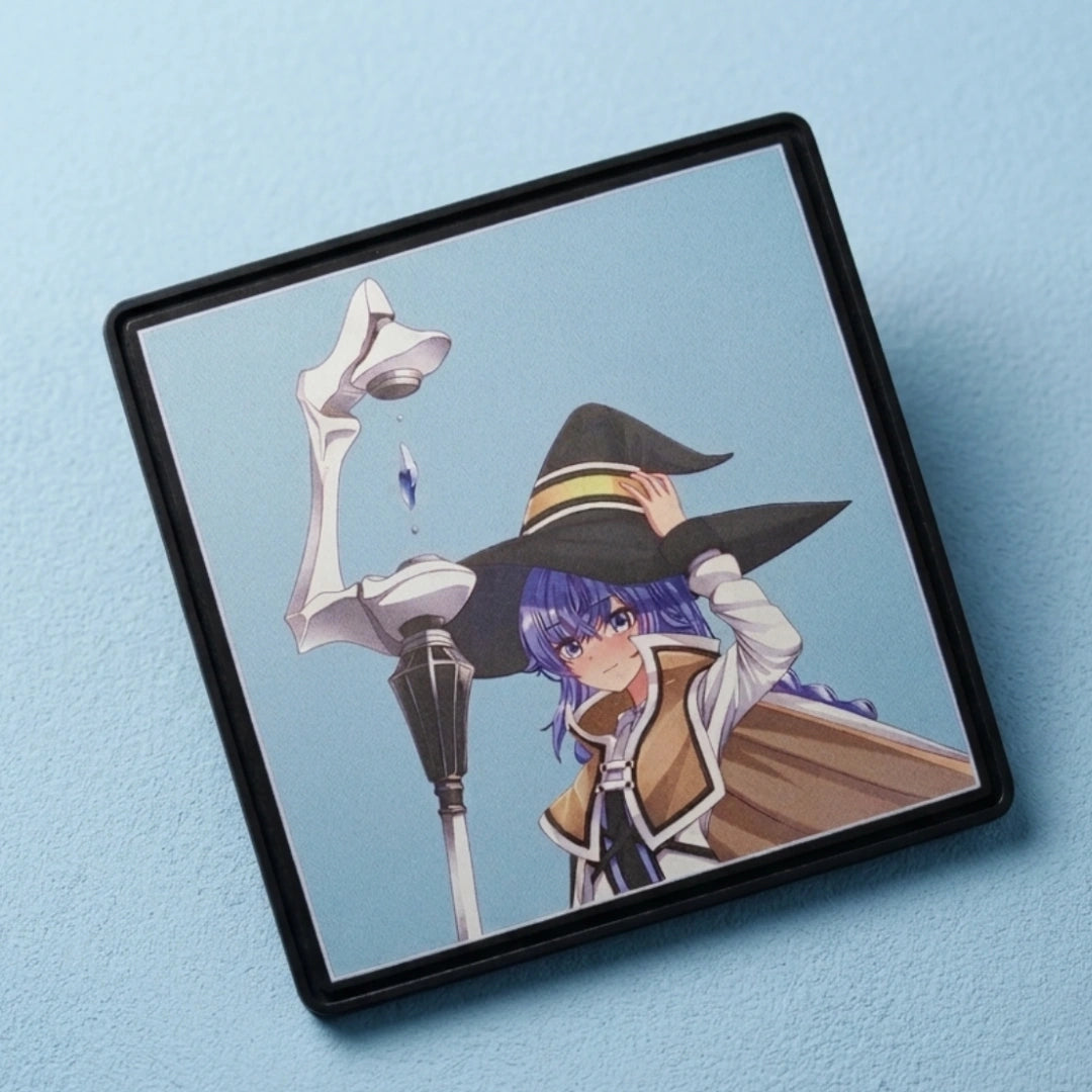 A square framed art print featuring an anime-style illustration of a witch character with purple hair, a large black hat, and a white staff, displayed on a light blue textured background.
