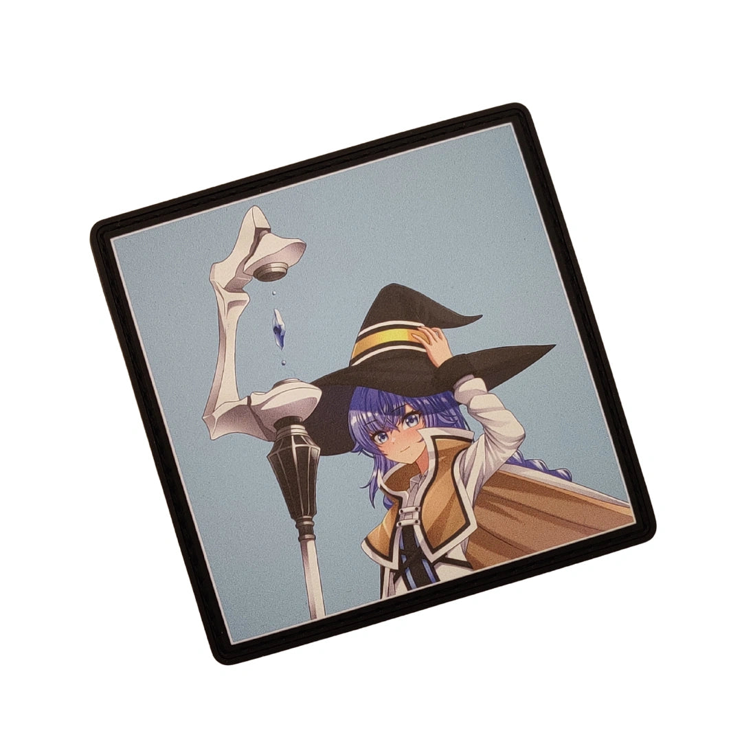 A square printed item with rounded corners and a black border, shown at an angle on a plain white background. The print features anime-style artwork of a woman with purple hair wearing a large black witch hat and a tan coat against a pale blue-gray background.